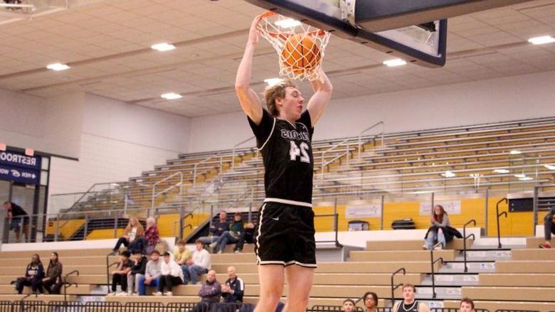 Penn State DuBois senior forward Beau Verdill slams the ball home during a drive in the lane in the second half of the team’s game at Clarion University on Nov. 26.